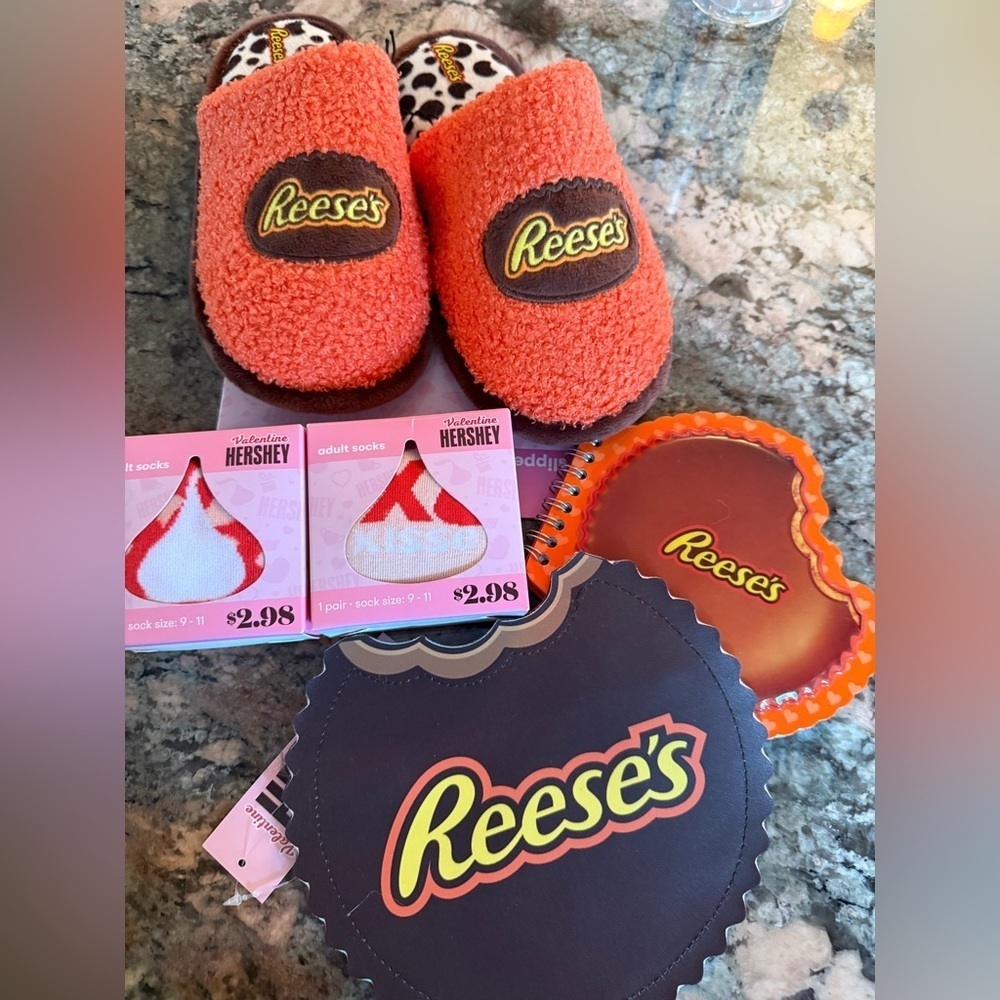 Reese's Orange Slippers Sz 2/3 M Bag, Note pad, 2 pair of Socks
All Brand New